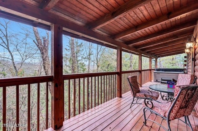 deck featuring a hot tub