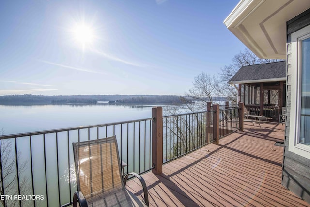 wooden terrace with a water view