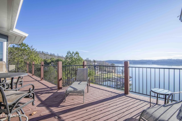 wooden terrace with a water view