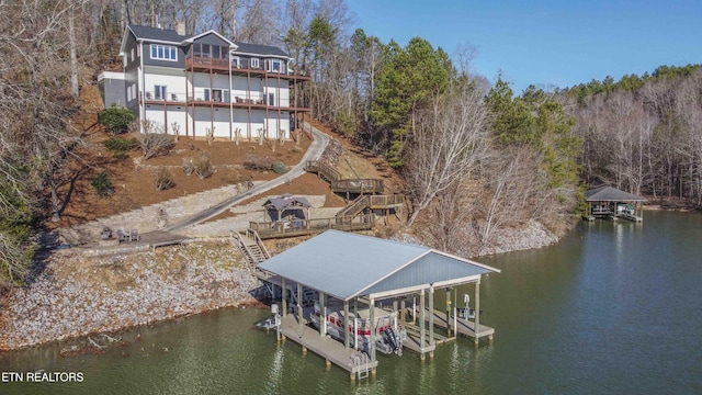 view of dock featuring a water view and boat lift