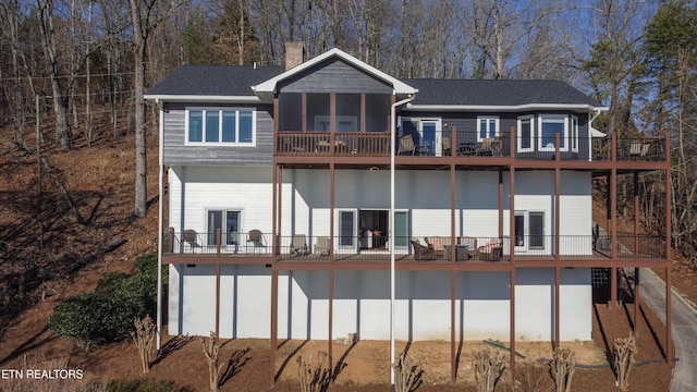 rear view of property with a chimney