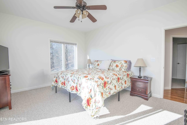 bedroom with carpet flooring, ceiling fan, and baseboards