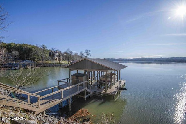 dock area featuring a water view and boat lift