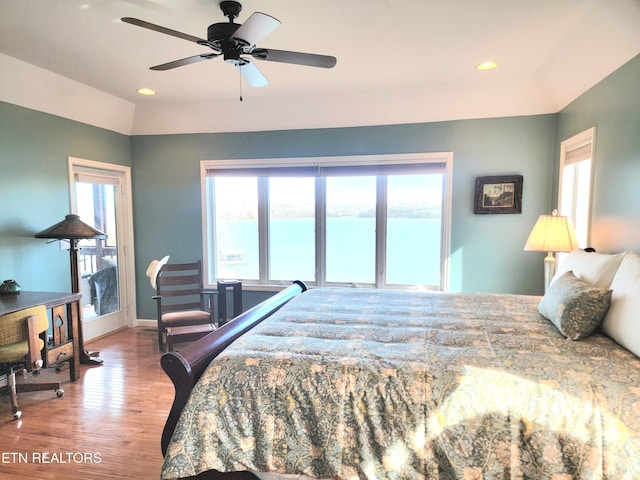 bedroom with baseboards, ceiling fan, wood finished floors, vaulted ceiling, and recessed lighting