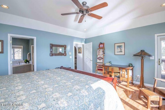 bedroom with baseboards, a ceiling fan, lofted ceiling, ensuite bath, and recessed lighting