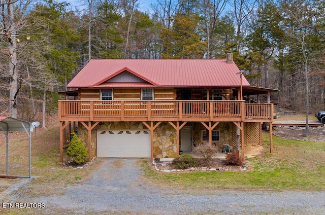 log-style house with a garage, stone siding, a chimney, metal roof, and gravel driveway