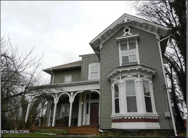 italianate house featuring covered porch