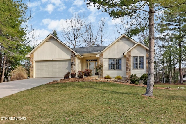 single story home with a garage, a front yard, and driveway