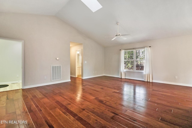 unfurnished living room featuring ceiling fan, vaulted ceiling with skylight, wood finished floors, visible vents, and baseboards