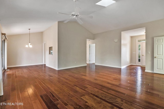 unfurnished living room with high vaulted ceiling, baseboards, dark wood finished floors, and ceiling fan with notable chandelier