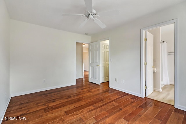 unfurnished bedroom with hardwood / wood-style floors, a ceiling fan, and baseboards