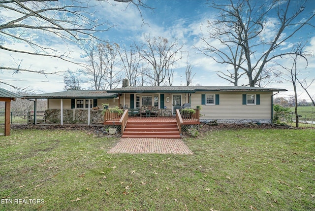 rear view of property featuring a chimney, fence, a porch, and a lawn