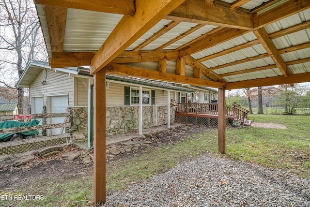 view of side of home with a garage and a yard