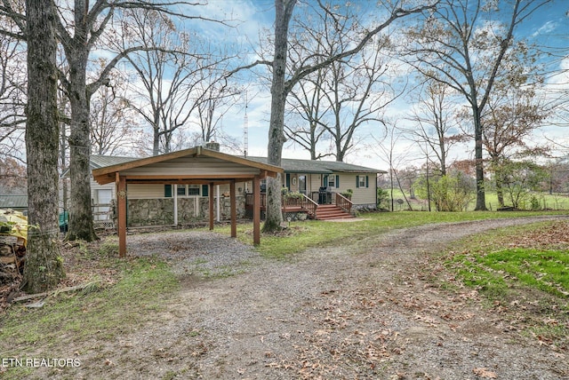 view of front facade with a carport and driveway