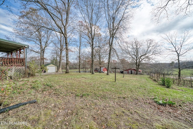 view of yard with an outbuilding and a detached garage