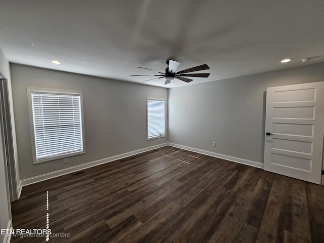 spare room featuring a ceiling fan, baseboards, dark wood-type flooring, and recessed lighting