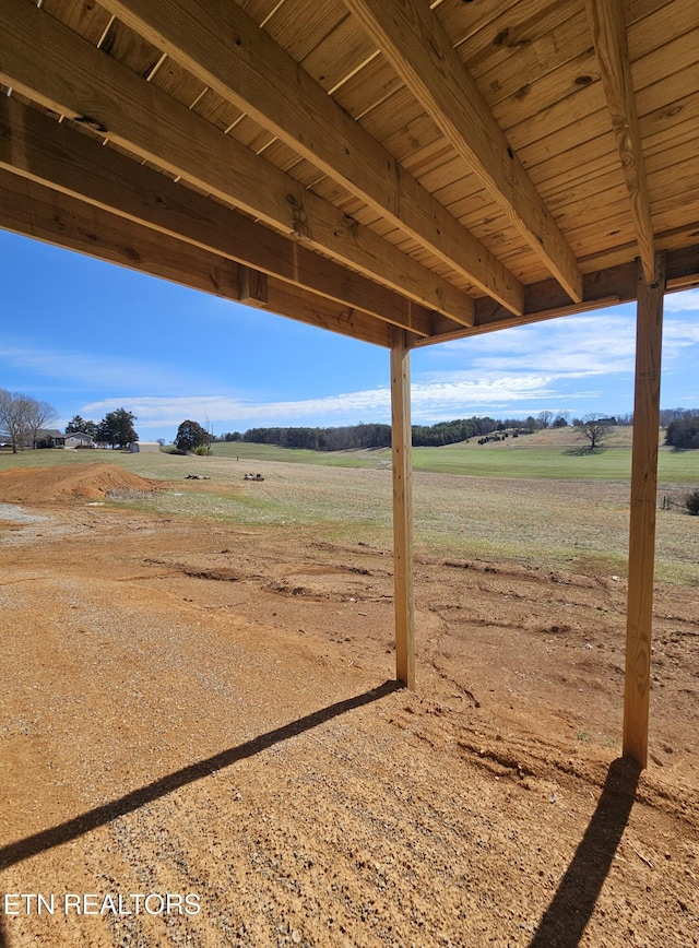 view of yard with a rural view