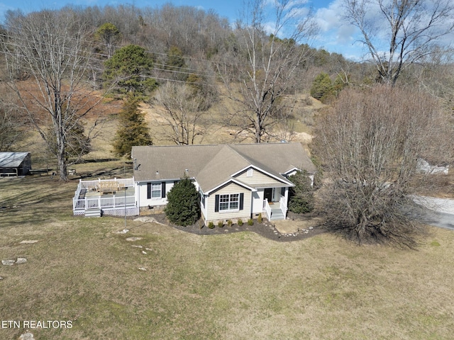 view of front of home with crawl space and a front lawn