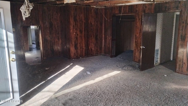 interior space featuring wood walls