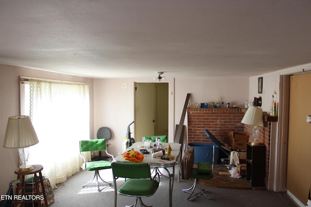 dining area featuring a wood stove