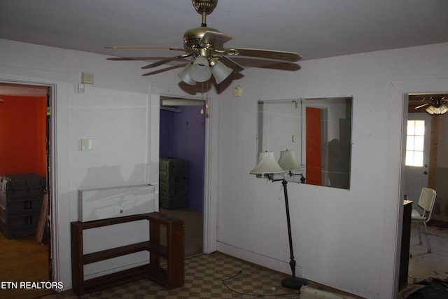 interior space featuring ceiling fan and tile patterned floors