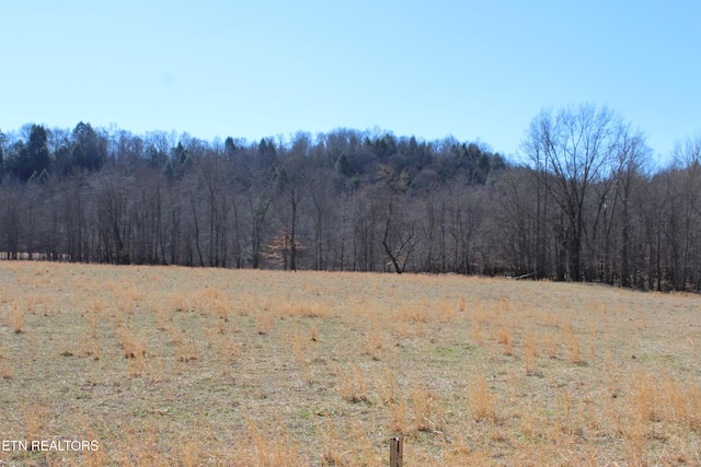 view of landscape with a view of trees