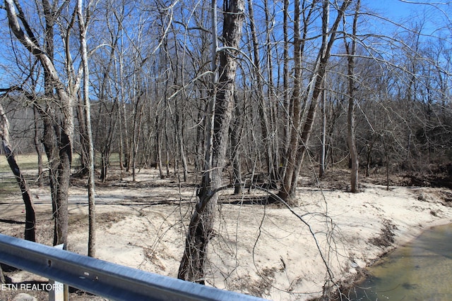 exterior space with a forest view