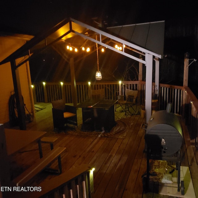 deck at night with a gazebo