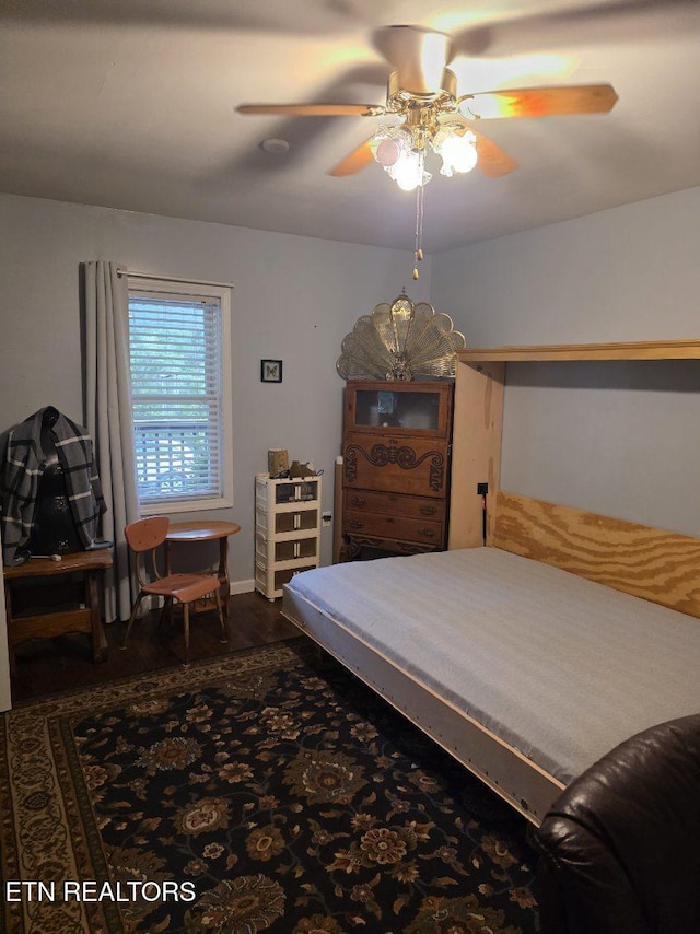 bedroom with ceiling fan and wood finished floors
