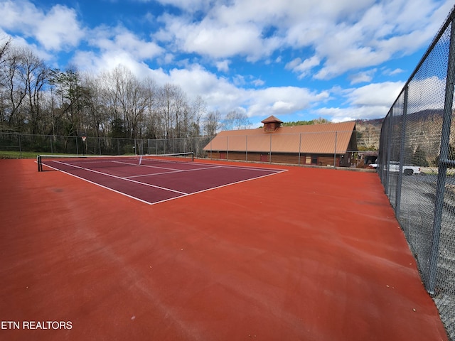 view of sport court with community basketball court and fence