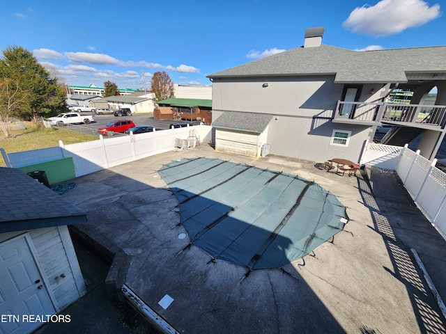 view of pool featuring a patio area and a fenced backyard