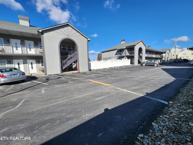 uncovered parking lot with fence