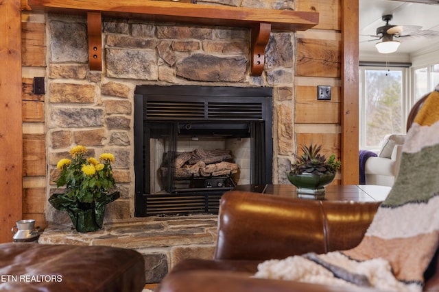 room details with ornamental molding, a fireplace, and a ceiling fan