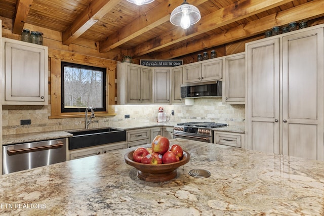 kitchen with tasteful backsplash, wood ceiling, appliances with stainless steel finishes, light stone countertops, and a sink