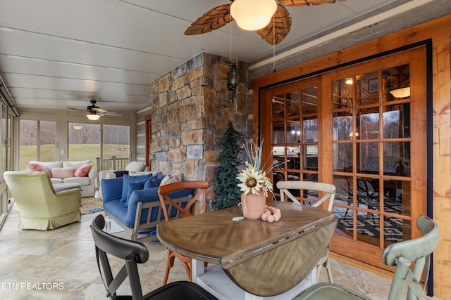 sunroom / solarium with ceiling fan