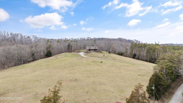 birds eye view of property with a forest view