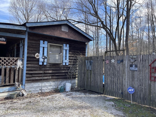 view of home's exterior with fence