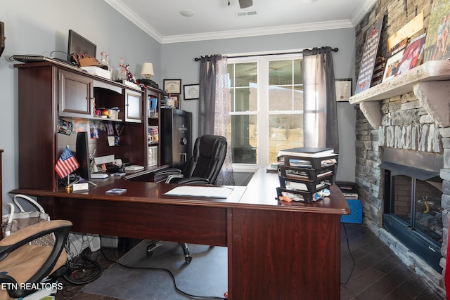 office area featuring dark wood-style floors, a fireplace, visible vents, and crown molding