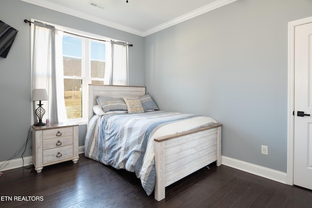 bedroom with dark wood-style floors, baseboards, visible vents, and ornamental molding