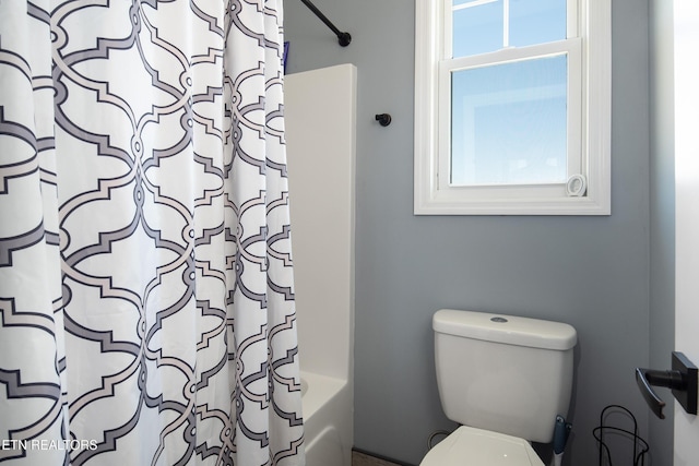 full bath featuring shower / bath combo and toilet