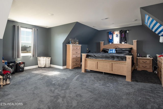 carpeted bedroom with lofted ceiling, visible vents, and baseboards