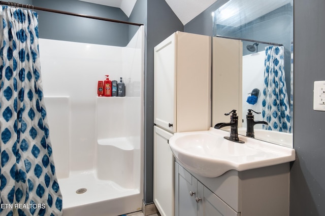 full bathroom featuring vanity and a shower with shower curtain