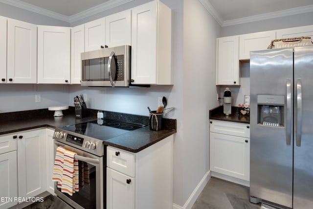 kitchen with ornamental molding, appliances with stainless steel finishes, and white cabinets