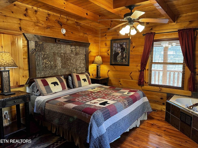 bedroom with wooden ceiling, wood finished floors, beam ceiling, and wooden walls