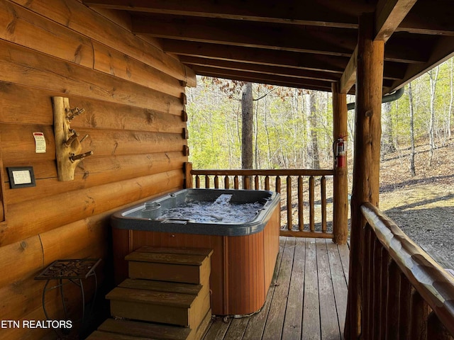 deck with a hot tub