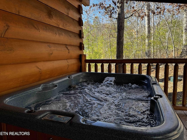 deck featuring a hot tub