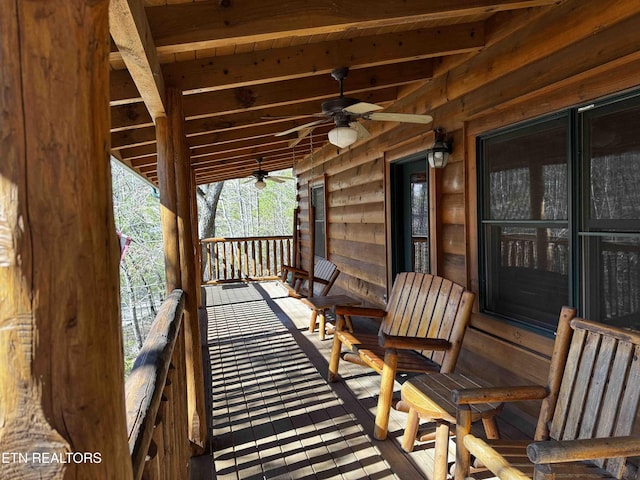 exterior space with a ceiling fan