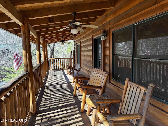 wooden terrace featuring ceiling fan