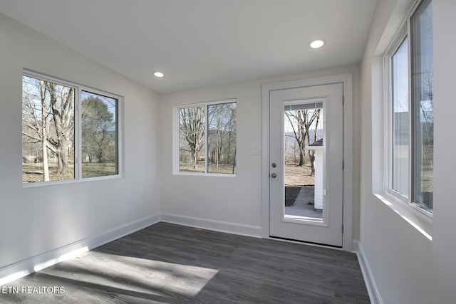 doorway featuring recessed lighting, baseboards, and dark wood-style flooring