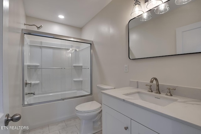 full bathroom featuring marble finish floor, toilet, vanity, and shower / bath combination with glass door